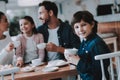 Happy Boy with Cup.Drink Tea.Cupcake. Celebration. Royalty Free Stock Photo