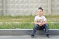 Happy boy on a curb Royalty Free Stock Photo