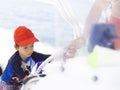 Happy boy driving a boat Royalty Free Stock Photo