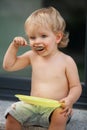 Happy boy eating chocolate cake Royalty Free Stock Photo