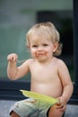 Happy boy eating chocolate cake Royalty Free Stock Photo