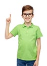 Happy boy in eyeglasses pointing finger up Royalty Free Stock Photo