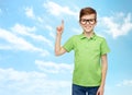 Happy boy in eyeglasses pointing finger up Royalty Free Stock Photo