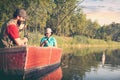 boy with first catch on fishing with father