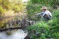 Happy boy fishing on the river Royalty Free Stock Photo