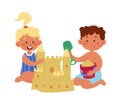 Happy boy and girl build sand castle