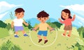 Happy boy and girl children playing jump rope in a green and sunny hill field Royalty Free Stock Photo