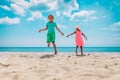 Happy boy and girl dance at beach, kids enjoy vacation Royalty Free Stock Photo