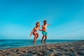 Happy boy and girl enjoy beach, kids play on sea vacation Royalty Free Stock Photo