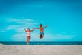 Happy boy and girl enjoy beach, kids play on sea vacation Royalty Free Stock Photo