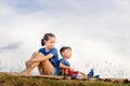 Happy boy and girl with guitar having fun outdoor, Portrait of adorable brother and sister playing outdoors. Asian kids singing Royalty Free Stock Photo