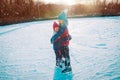 Happy boy and girl hug while skating together, kids winter sport Royalty Free Stock Photo