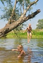 Happy boy and girl play in lake Royalty Free Stock Photo