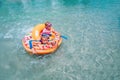 Happy boy and girl play with water, kids have fun with water guns on beach Royalty Free Stock Photo