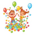 Happy boy and girl playing with colorful balls at playground Royalty Free Stock Photo