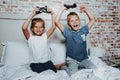 Happy boy and girl playing with game console