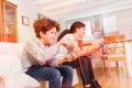 Happy boy and girl playing video games together Royalty Free Stock Photo