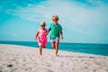 Happy boy and girl run at beach, kids play on vacation Royalty Free Stock Photo