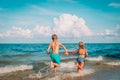 Happy boy and girl run play at beach Royalty Free Stock Photo