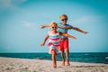 Happy boy and girl run play at beach Royalty Free Stock Photo