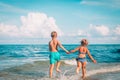 Happy boy and girl run play at beach Royalty Free Stock Photo