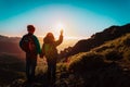 Happy boy and girl travel in mountains at sunset, kids enjoy hiking Royalty Free Stock Photo