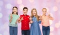 Happy boy and girls showing peace hand sign