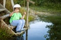 Happy boy go fishing on the river, one children fisherman with a