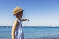 Boy in hat on the beach looking at sea horizon Royalty Free Stock Photo