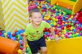 Happy boy is having fun in kids amusement park and indoor play center.  Activity toys for little kid Royalty Free Stock Photo