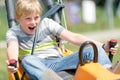 Happy boy having fun at summer bobsled track Royalty Free Stock Photo