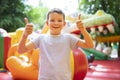 Happy boy having a lots of fun on a colorful inflate castle Royalty Free Stock Photo