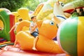 Happy boy having a lots of fun on a colorful inflate castle Royalty Free Stock Photo