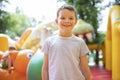 Happy boy having a lots of fun on a colorful inflate castle Royalty Free Stock Photo