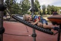 Happy boy having a rest on the playground in local park during her travelling Royalty Free Stock Photo