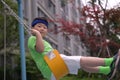 A boy with a headband have a ride on a swing Royalty Free Stock Photo