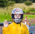 Happy boy with helmet at the kart trail Royalty Free Stock Photo