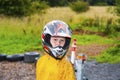 Happy boy with helmet at the kart trail Royalty Free Stock Photo