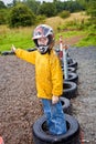 Happy boy with helmet at the kart trail Royalty Free Stock Photo