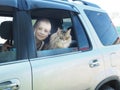 Happy boy and his companion cat in the car Royalty Free Stock Photo