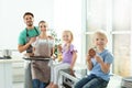 Happy boy and his family eating homemade oven baked cookies Royalty Free Stock Photo