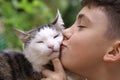 Happy boy hold cat smiling close up photo Royalty Free Stock Photo