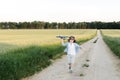 Happy boy holding airplane toy during running Royalty Free Stock Photo