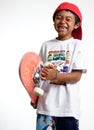 Happy boy holding his skateboard Royalty Free Stock Photo