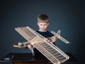 Happy boy holding the model airplane