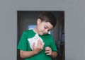 Happy boy holding piggy bank with smiling face. Portrait of a cheerful child showing money saving box.School kid Learning Royalty Free Stock Photo