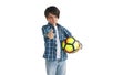 Happy boy holding soccer ball and smiling gesturing approval sign isolated on white background Royalty Free Stock Photo