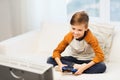 Happy boy with joystick playing video game at home Royalty Free Stock Photo