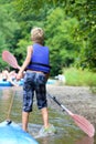 Happy boy kayaking on the river Royalty Free Stock Photo