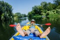 Happy boy kayaking on the river on a sunny day during summer vacation Royalty Free Stock Photo